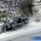 Illustration for article titled Daniel Craig Crashes Aston Martin DBS Into Quarry